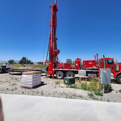 Red drilling equipment on sunny day